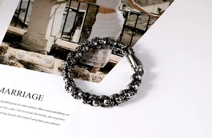 Detail shot of vintage punk skull bracelet in oxidized stainless steel with clasp