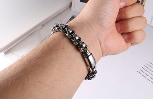 Close-up of vintage skull bracelet in stainless steel on wrist with punk styling