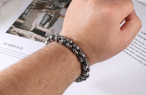 Detailed view of interconnected skull links on a stainless steel gothic men's bracelet