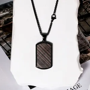 Men's rectangular black pendant necklace with diagonal textured pattern on stone