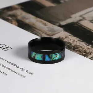 Men's black stainless steel ring featuring iridescent abalone shell inlay with beveled edges