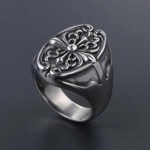 Macro shot of gothic cross relief pattern and texture on vintage stainless steel ring