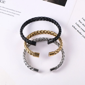 Three-piece set of twisted braided stainless steel open bangles in black, gold, and silver