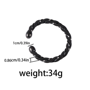 Macro view of black stainless steel twisted cable bracelet showing 34g weight and 1cm size