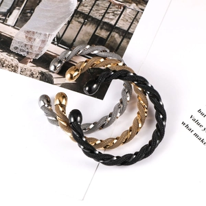 Three-piece set of woven mesh open bracelets in silver, gold, and black metal tones