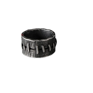 Vintage stainless steel ring for men with industrial stitch pattern and oxidized silver finish