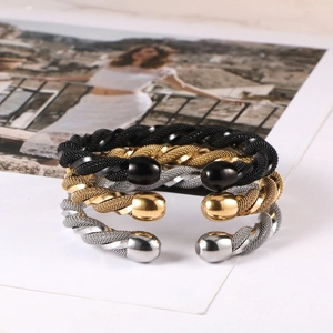 Three-piece stainless steel twisted cable open bangles in black, gold, and silver finishes