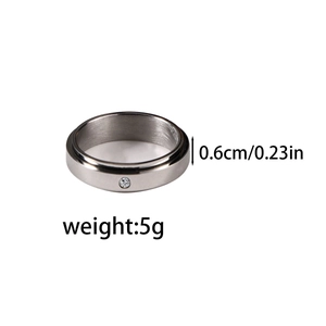 Detail showing 6mm width and 5g weight of stainless steel spinner ring with small zircon