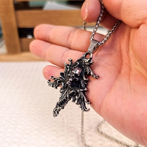 Gothic vintage stainless steel necklace with hand-held silver skull cross pendant