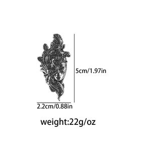 Detailed view of tribal mask pendant with dimensions 5cm height and 2.2cm width