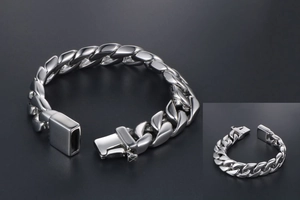 Detailed view of polished silver cuban link chain bracelet with secure mechanical clasp