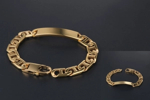 Detailed macro view of gold-plated stainless steel anchor chain bracelet with name plate