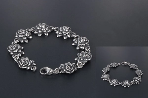 Macro shot of retro stainless steel rose link bracelet with vintage oxidized finish details