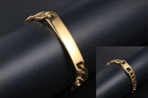 Detail of gold-plated mariner link bracelet featuring a smooth rectangular ID metal tag