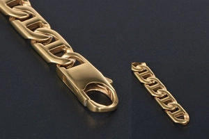 Macro detail of gold-plated H-link chain necklace showing lobster clasp closure
