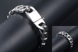 Detailed view of polished stainless steel Cuban link bracelet with secure square buckle