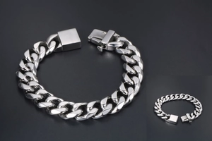 Detailed macro view of a heavy silver titanium steel curb chain bracelet for men