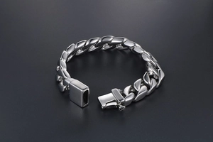 Detailed view of heavy silver stainless steel Cuban link bracelet with square box clasp