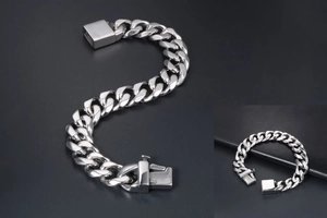 Detailed view of polished stainless steel cuban link chain with square box clasp closure