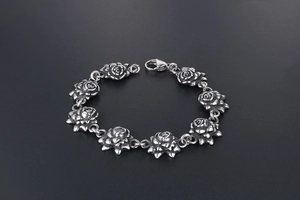 Macro shot of antique silver finish rose links on a vintage stainless steel bracelet