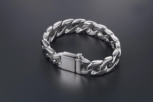 Detailed macro view of silver titanium steel curb chain with square box clasp