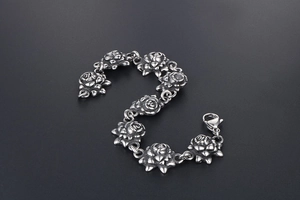 Macro detail of retro rose links stainless steel bracelet with lobster clasp closure