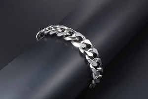 Polished silver stainless steel Cuban link bracelet with thick flat chain detail