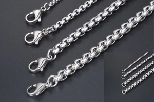 Detail view of various thicknesses of silver box chain necklaces with lobster clasp