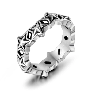 Retro punk style stainless steel ring featuring relief star patterns and geometric cutouts