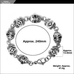 Detail of silver skull link bracelet with gothic cross patterns and lobster clasp
