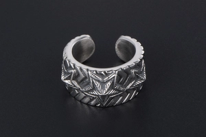 Detail of vintage silver pentagram ring with engraved star and retro blackened finish