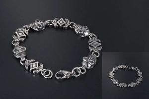 Detail view of retro skull link bracelet with lobster clasp in oxidized steel