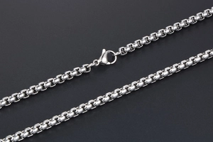 Detailed macro shot of silver titanium box chain with a polished lobster clasp closure