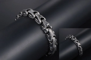 Macro shot of punk style titanium steel bracelet featuring detailed scale textures