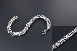 Detail of silver stainless steel Byzantine chain bracelet with a classic lobster clasp