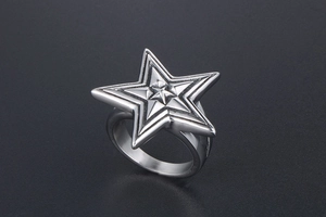 Detailed view of large pentagram star ring with a layered geometric punk design