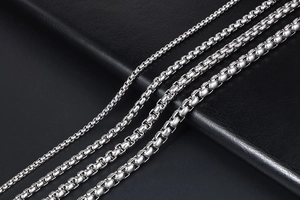 Detailed comparison of four polished silver titanium steel box chains in different sizes