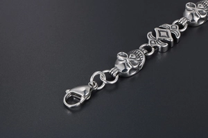 Detail of punk skull bracelet with lobster clasp and vintage black polished finish