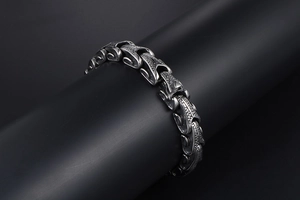 Detailed view of punk style titanium steel bracelet with textured scale pattern links
