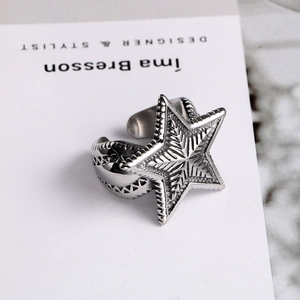 Adjustable vintage star titanium steel ring with industrial radial textures for men and women