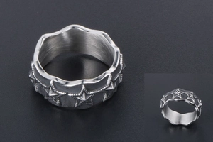 Macro detail of star embossed titanium steel ring with brushed vintage industrial finish
