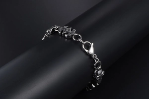 Close-up of gothic skull links on men's stainless steel punk hip hop street bracelet
