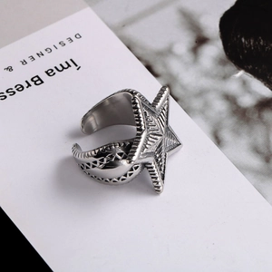 Macro shot of titanium steel starfish ring featuring vintage texture and open design