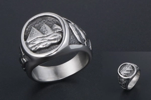 Detailed view of titanium steel ring featuring an Egyptian pyramid relief and hieroglyphs