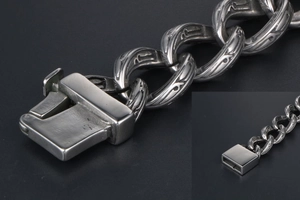 Macro shot of hip-hop titanium steel chain bracelet with gothic engraved patterns