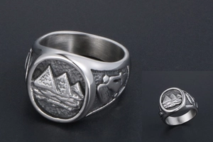 Detailed relief of Egyptian pyramids and figures on a vintage steel ring band