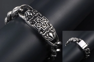 Detail of gothic cross plaque on a heavy Cuban link titanium steel bracelet for men