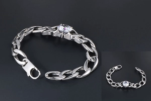 Detail of silver titanium steel chain bracelet with sparkling round cubic zirconia