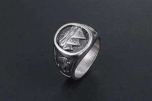 Detailed relief of winged angel on the side of a vintage steel mountain signet ring