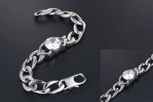 Detail of titanium steel Cuban bracelet with round zircon center and lobster clasp